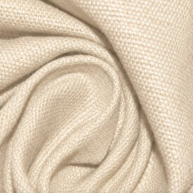 Close-up of draped cream-coloured cotton canvas